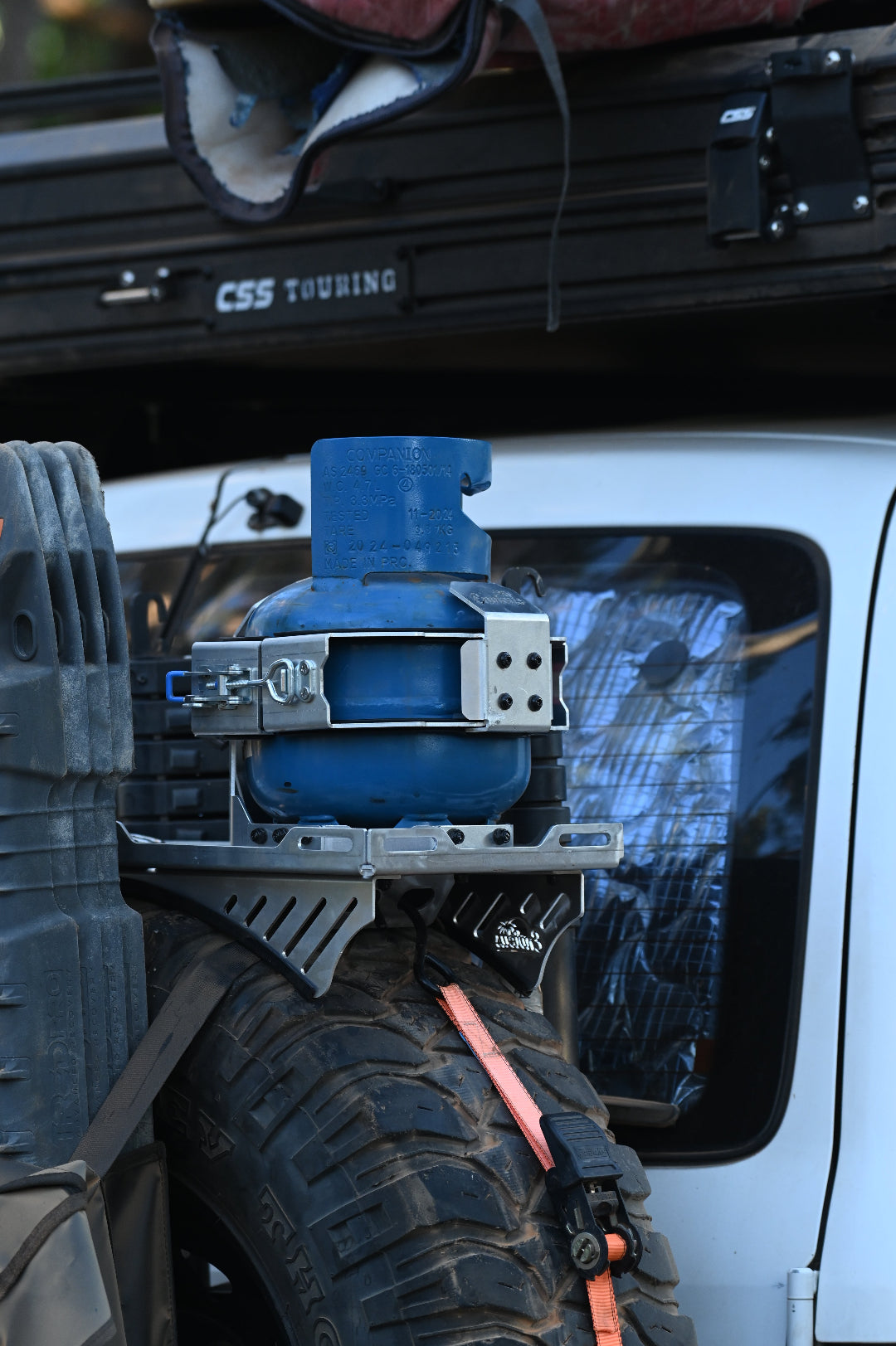 2kg gas bottle mount made from aluminium with spare tyre rack on a landcruiser