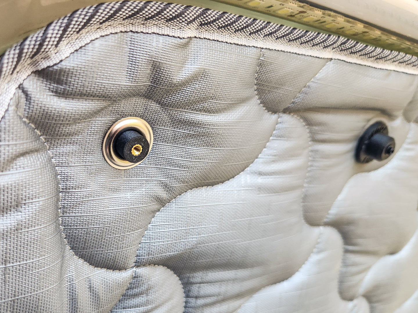 Close-up of a solar screen with a magnetic mount being installed.