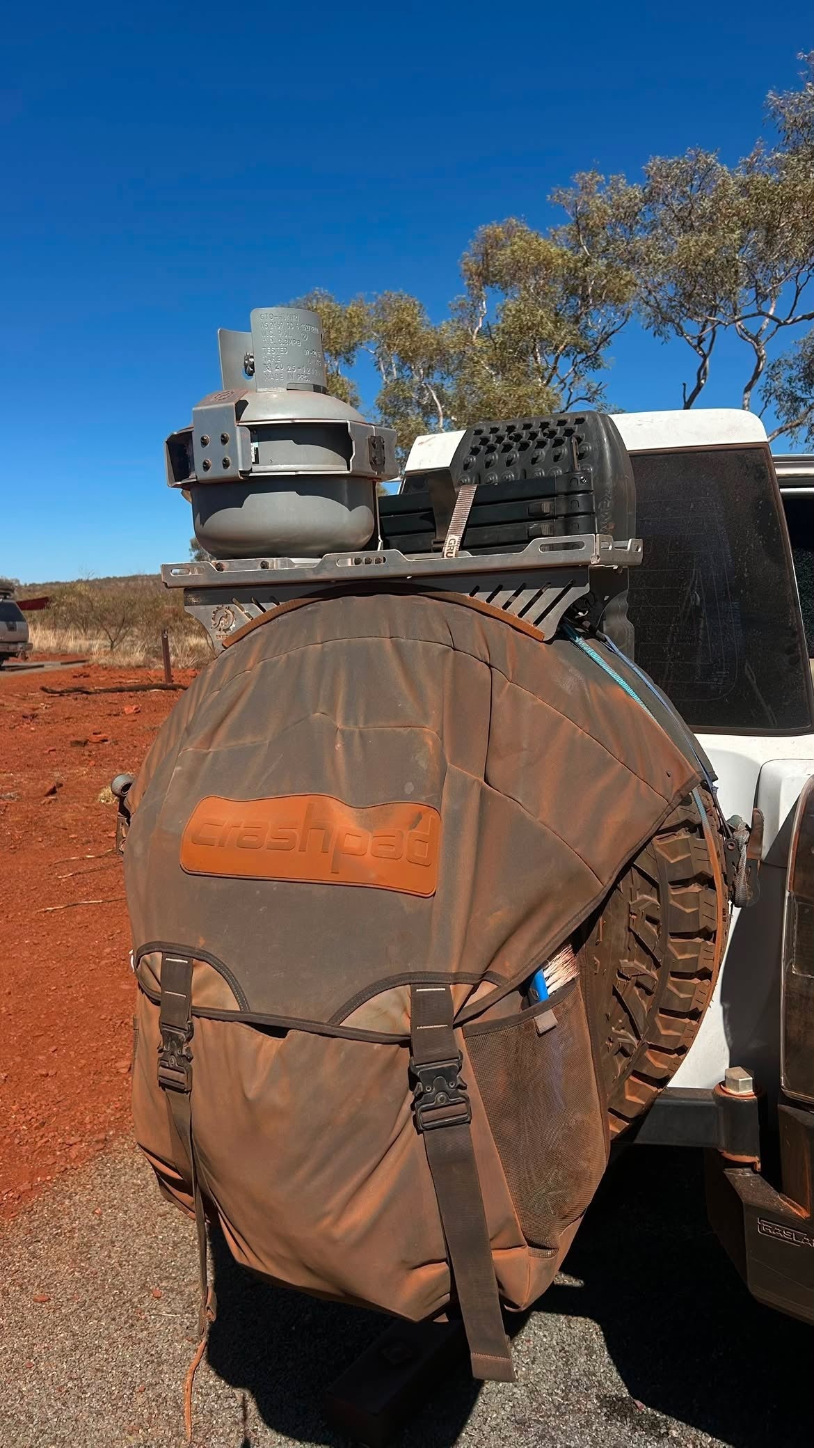 Spare Tyre Rack and Gas Bottle Holder Covered in Red Dust